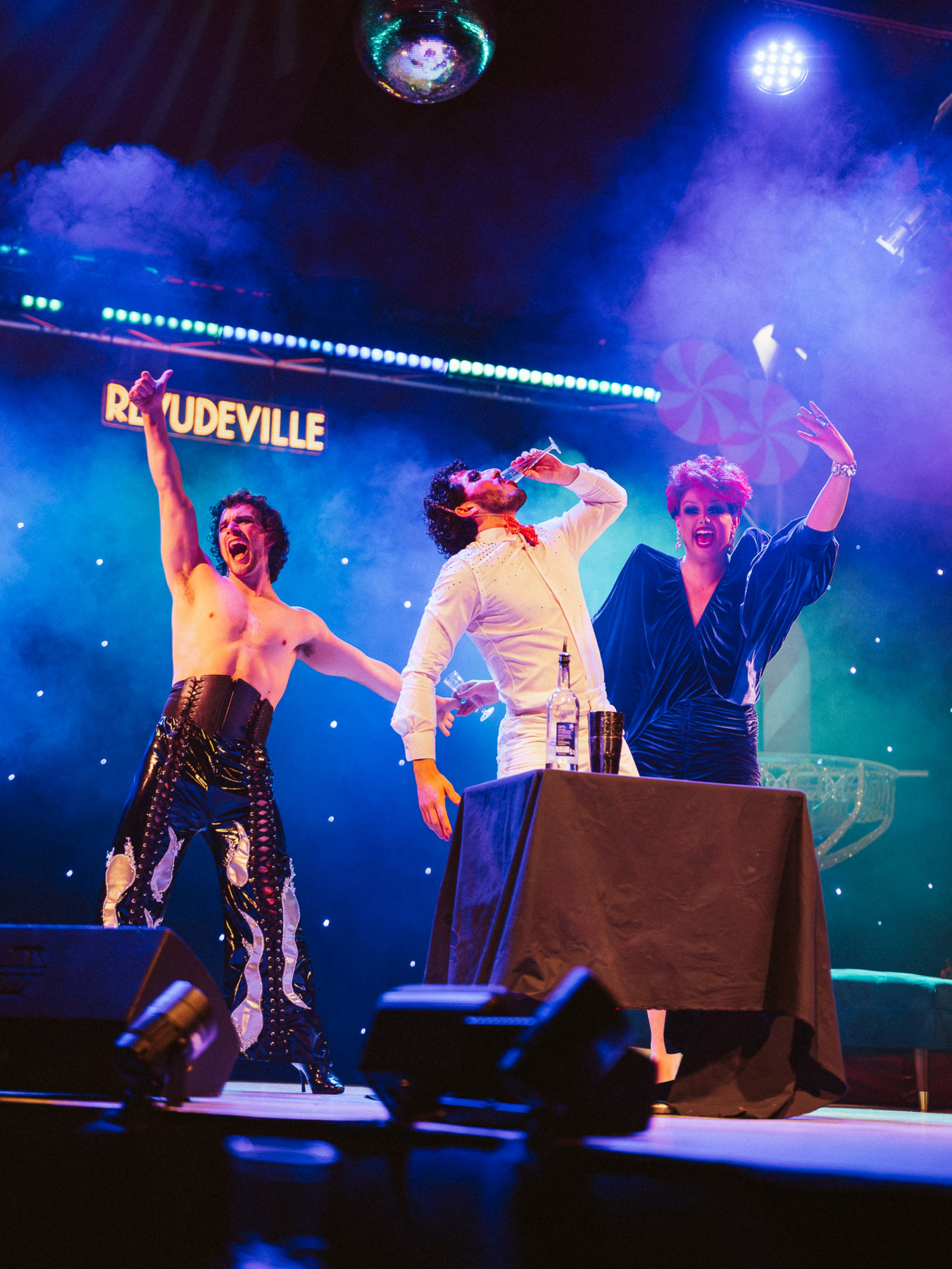 Two aerialist performers and a drag queen during a cabaret and variety show act