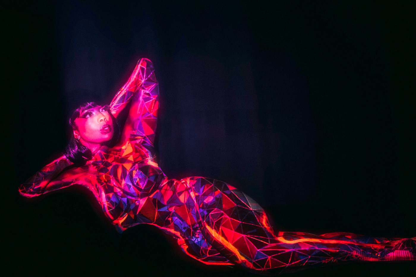 A body-mapping projection act at The Windmill Soho
